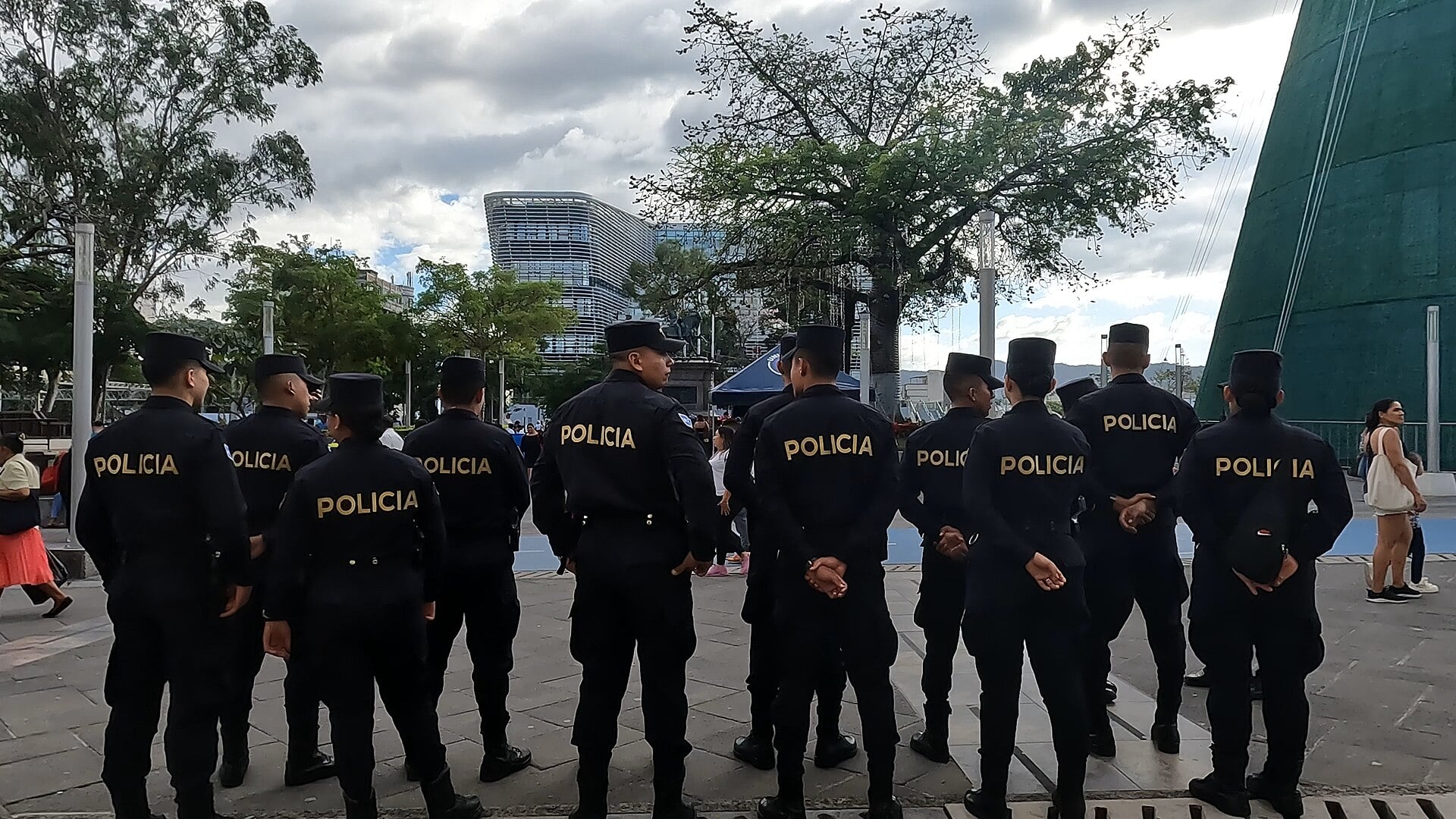 Officers of El Salvador’s National Civil Police standing in a row in the historic centre of San Salvador