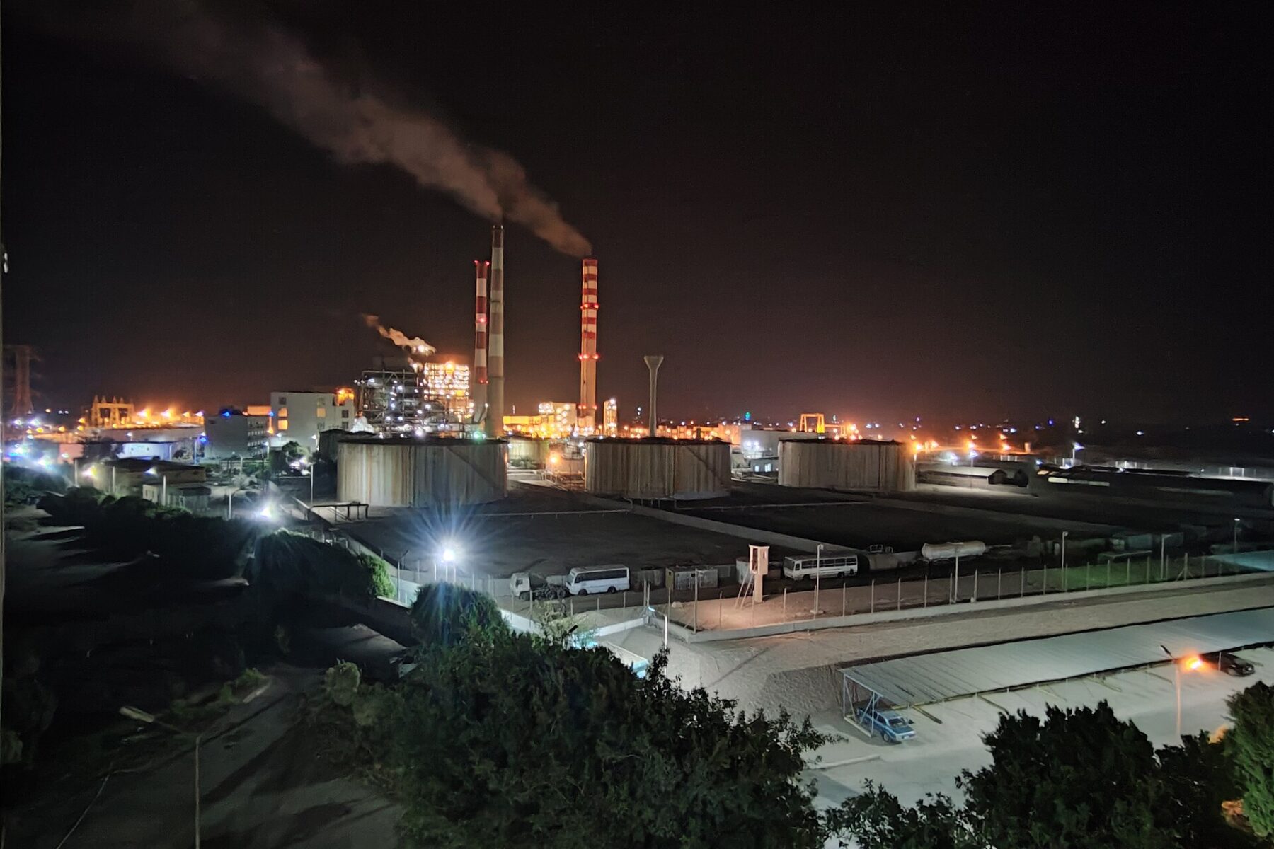 Steam power station in Assiut, Upper Egypt, lit up at night