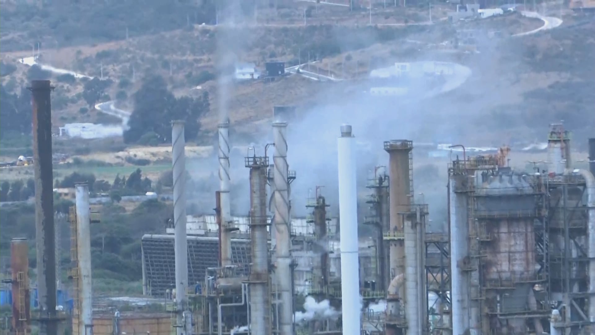 Chimneys and process towers at ENAP's Concón oil refinery in Chile