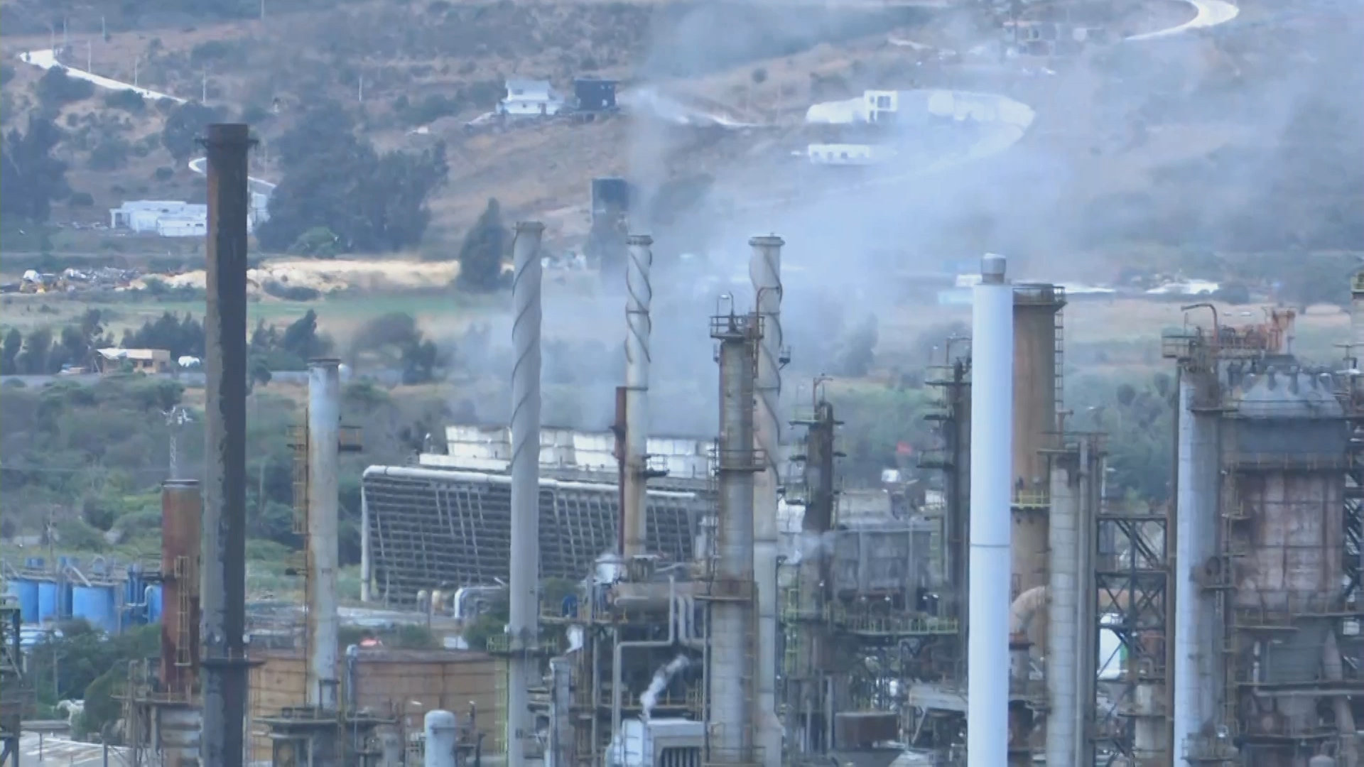 Chimneys and process towers at ENAP's Concón oil refinery in Chile