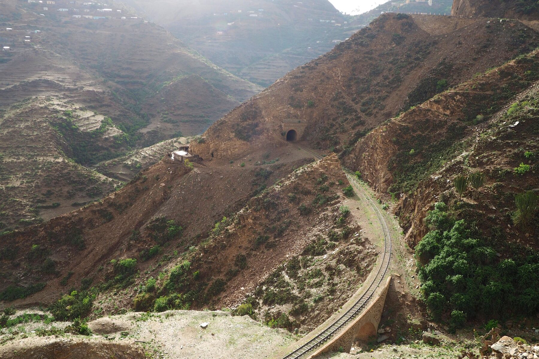 Terraced mountains and a railway line on the road from Asmara to Massawa, Eritrea