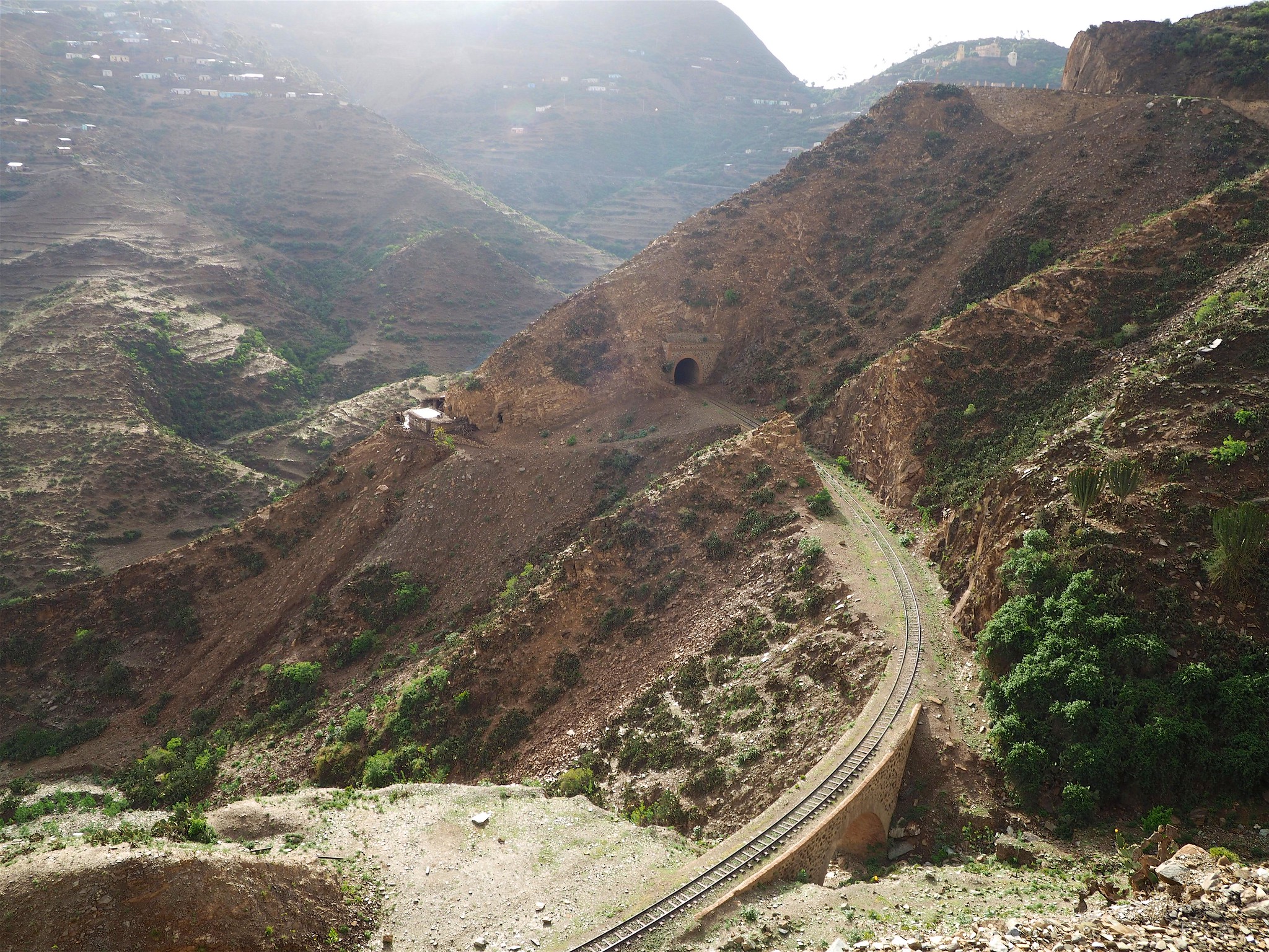 Terraced mountains and a railway line on the road from Asmara to Massawa, Eritrea