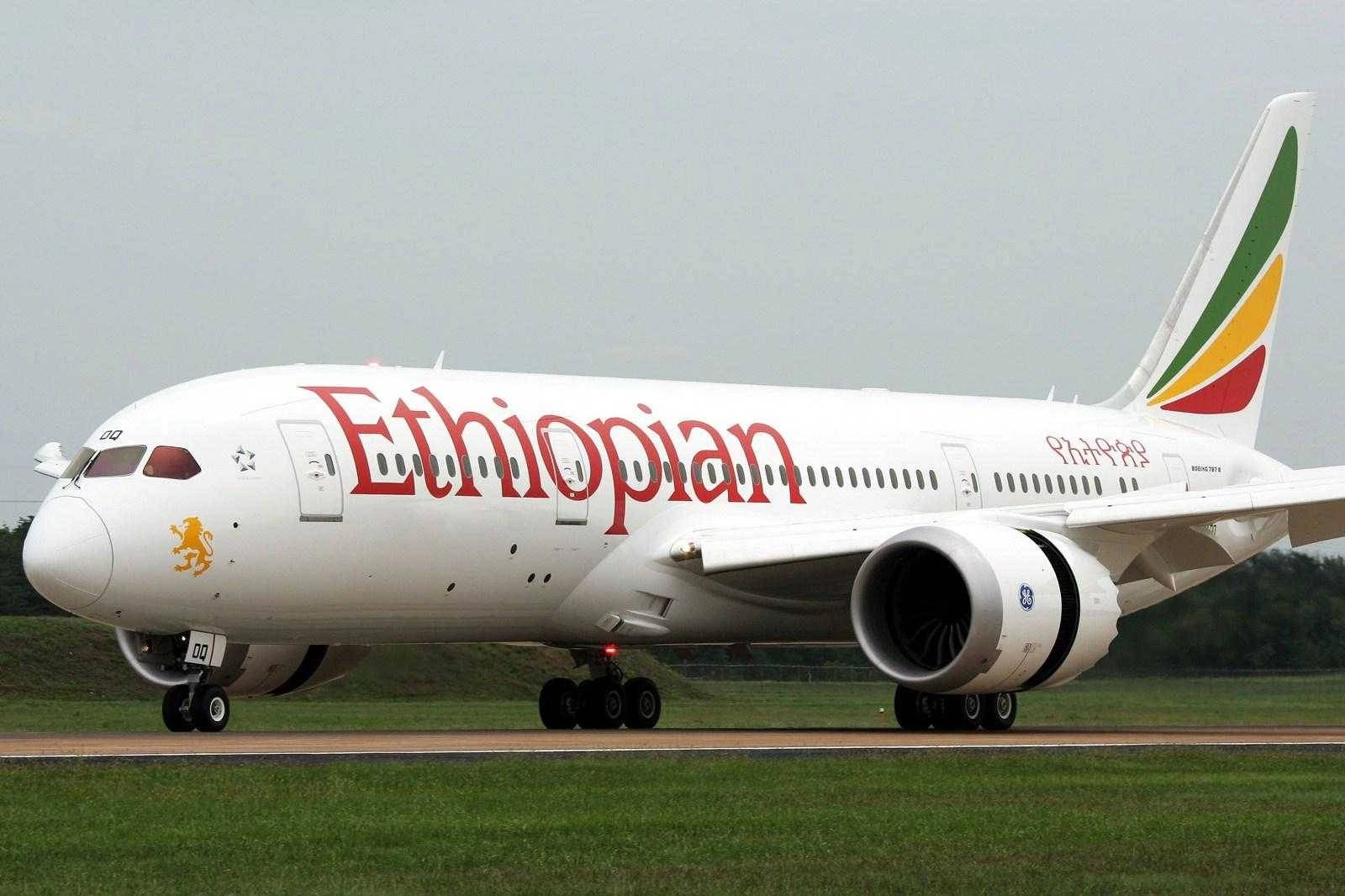Ethiopian Airlines Boeing 787 Dreamliner on a runway with the green, yellow and red tail