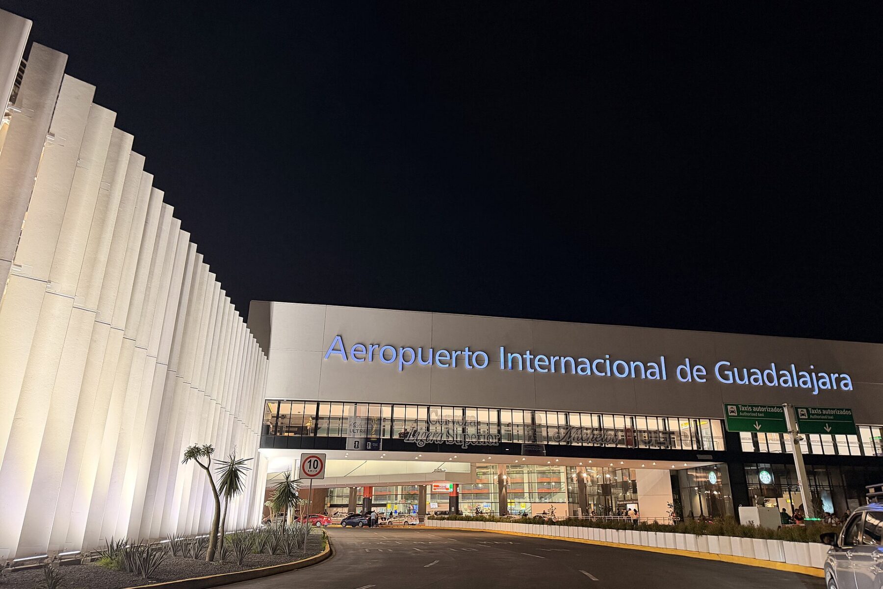Night view of the entrance of Guadalajara International Airport in Jalisco, Mexico