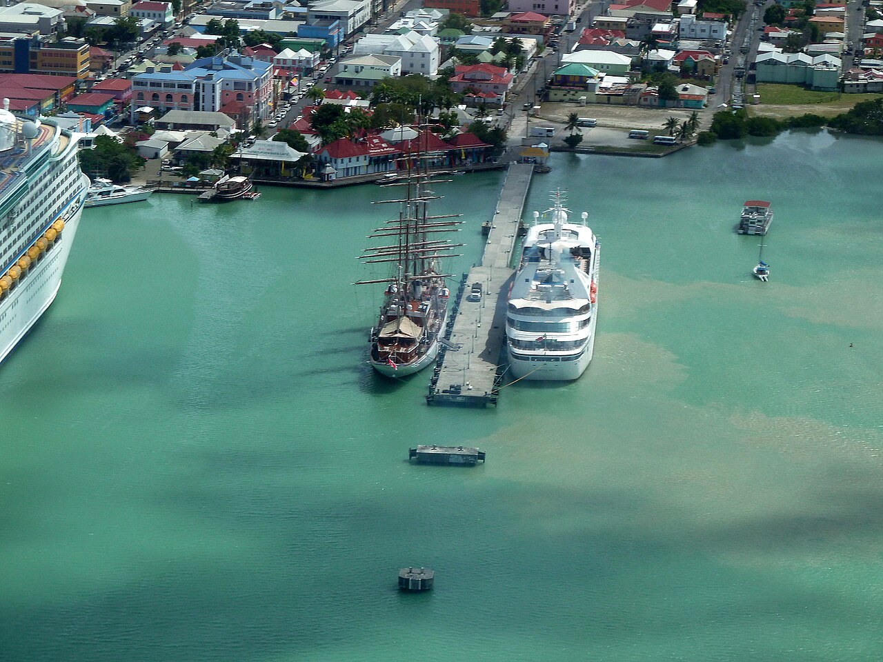 Antigua and Barbuda - Aerial view of the harbour of St John's, Antigua, with a cruise ship, a sailing ship and the town behind