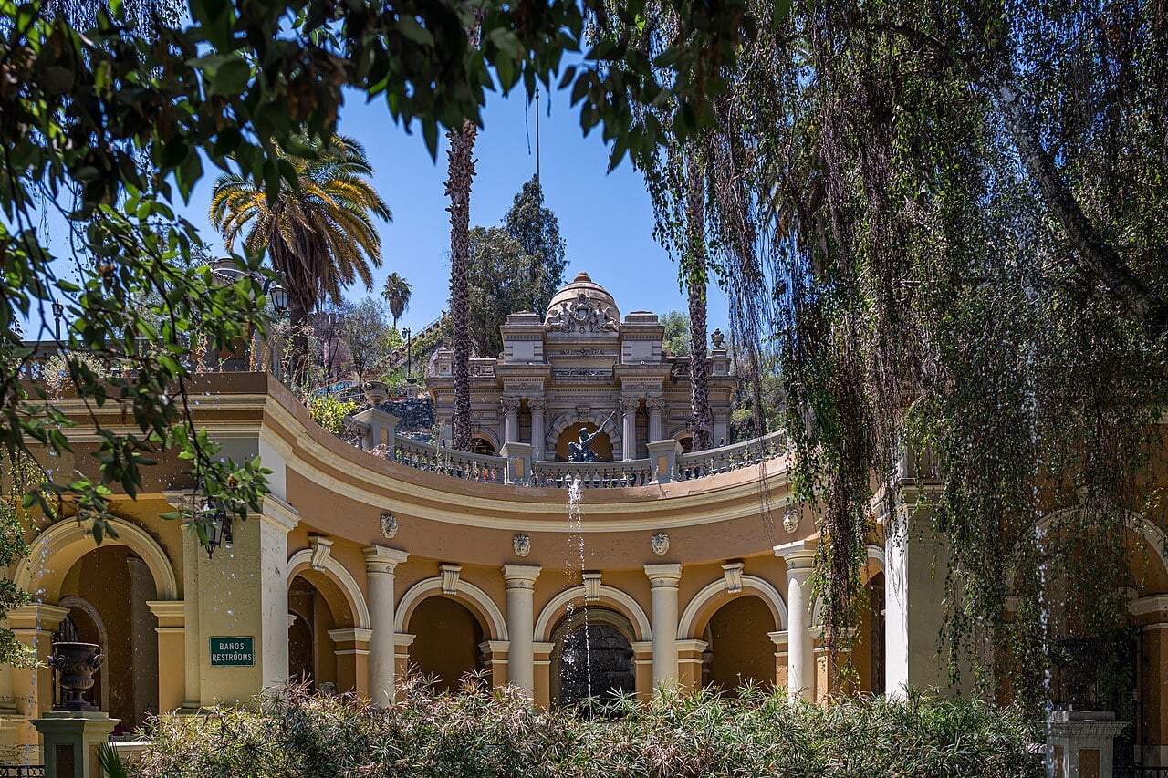 The Neptune Fountain terrace on Cerro Santa Lucia hill in central Santiago, Chile, framed by trees on a sunny day.