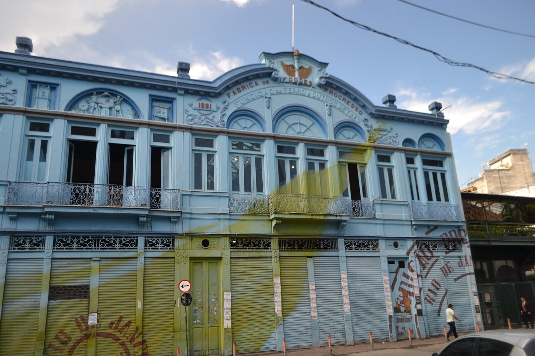 The pale blue facade of Fundição Progresso, a former stove and safe factory, on Rua dos Arcos in Rio de Janeiro's Lapa district