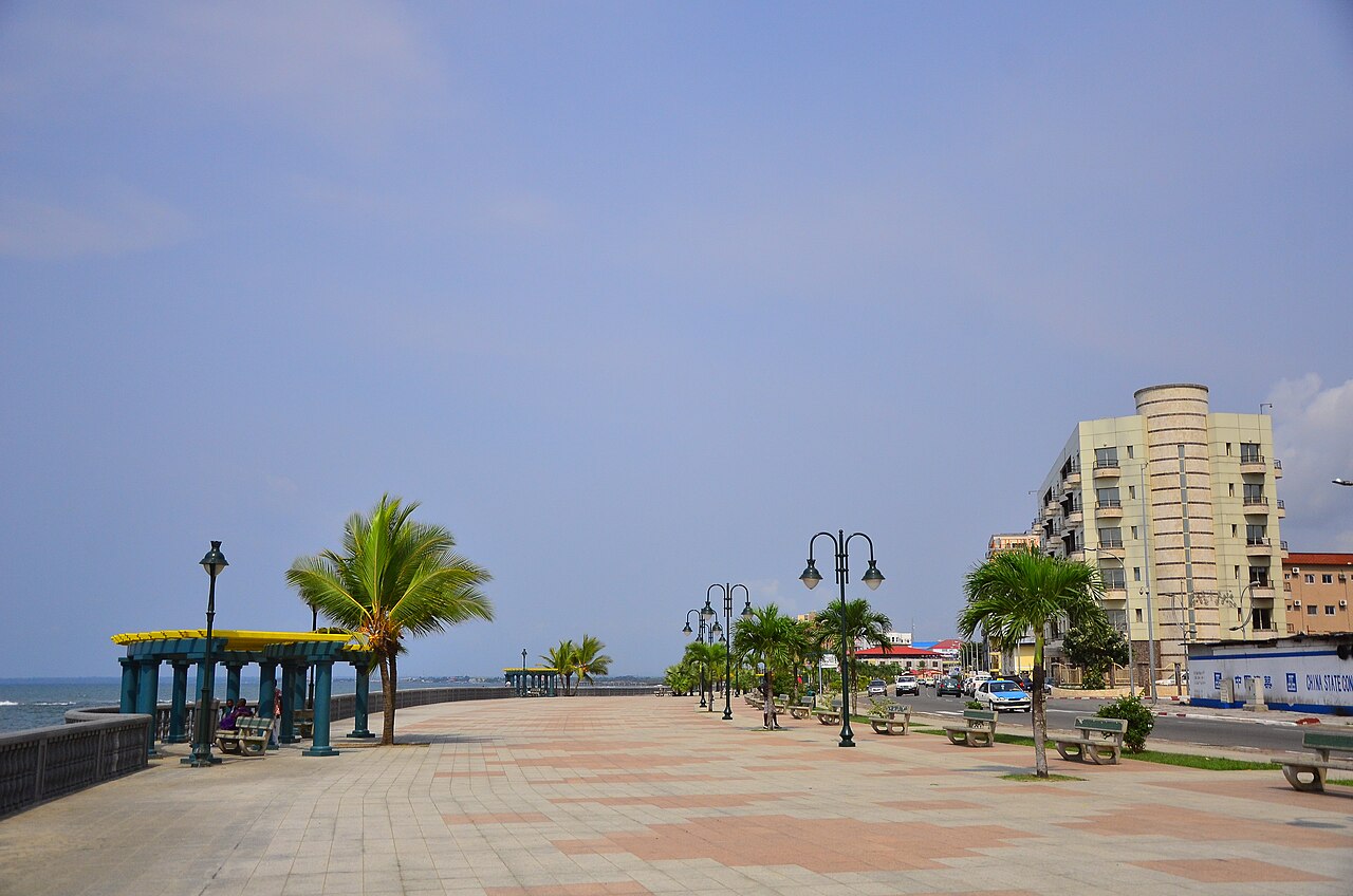 Seafront promenade with palm trees and apartment blocks in Bata, the main city on the mainland of Equatorial Guinea.