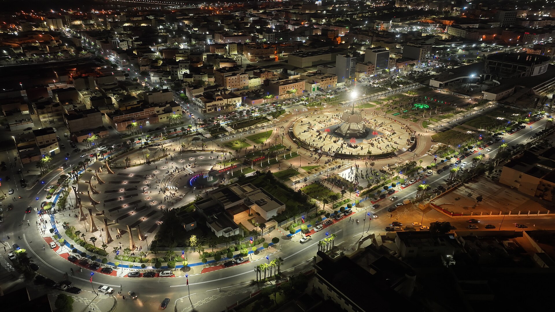 Night aerial view of roads, squares and apartment blocks in central Laayoune