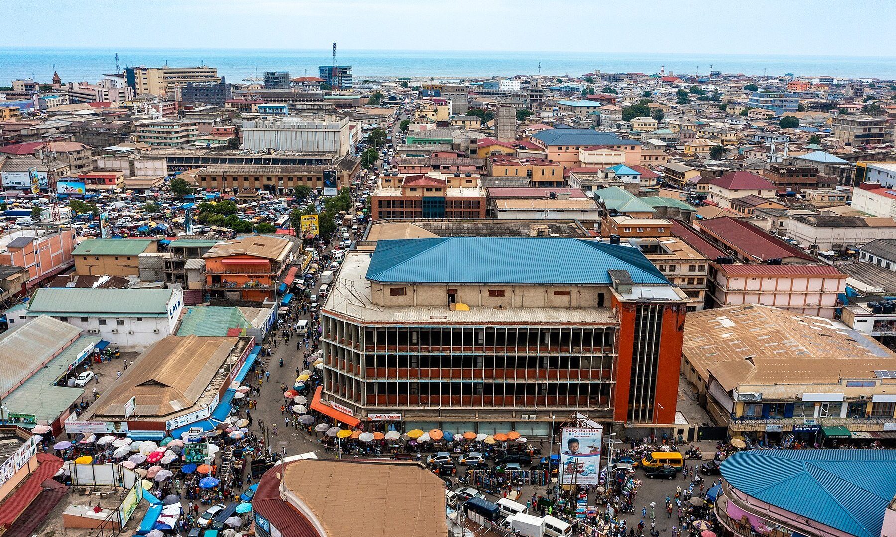 Aerial view of central Accra, Ghana, with market streets and the Gulf of Guinea
