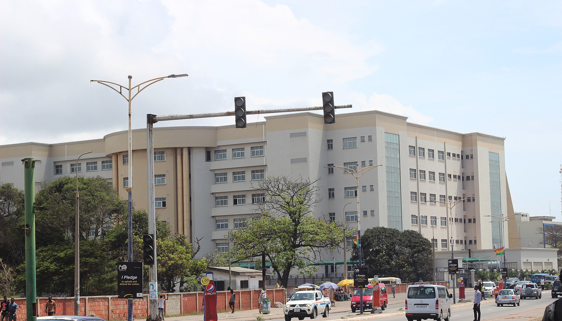 The multi-storey Law Court Complex in Accra, which houses the city's High Courts, seen from a road with traffic lights