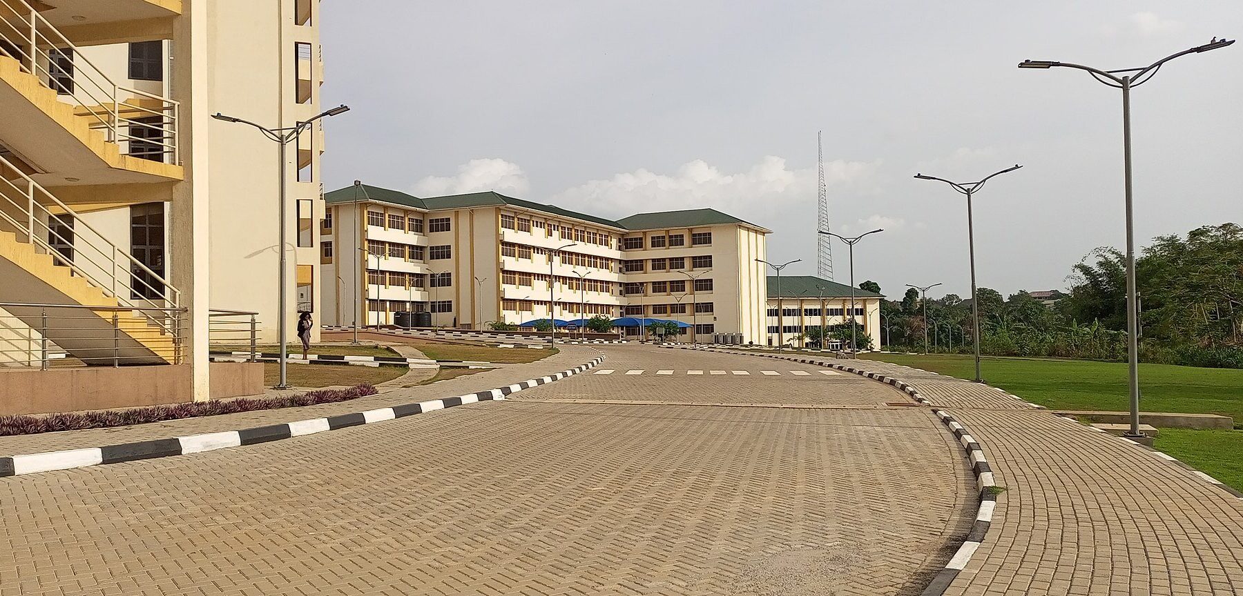 New Social Science block at KNUST in Kumasi, Ghana, with paved walkways and street lamps