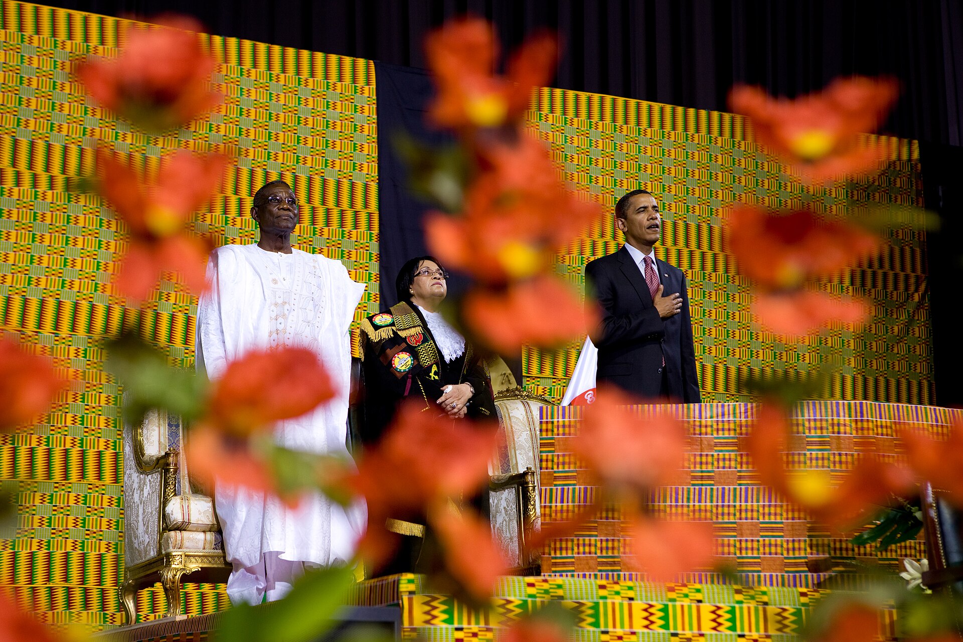 President Barack Obama on stage at Ghana’s Parliament in Accra in 2009 with Ghanaian officials beside him