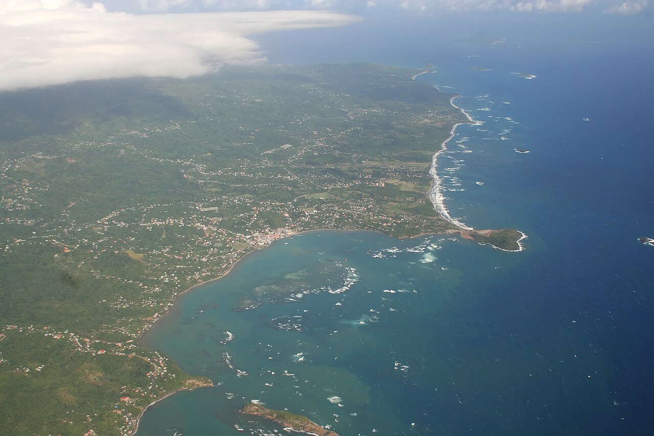Aerial view of the town of Grenville on the east coast of Grenada, with its bay, reefs and green hills