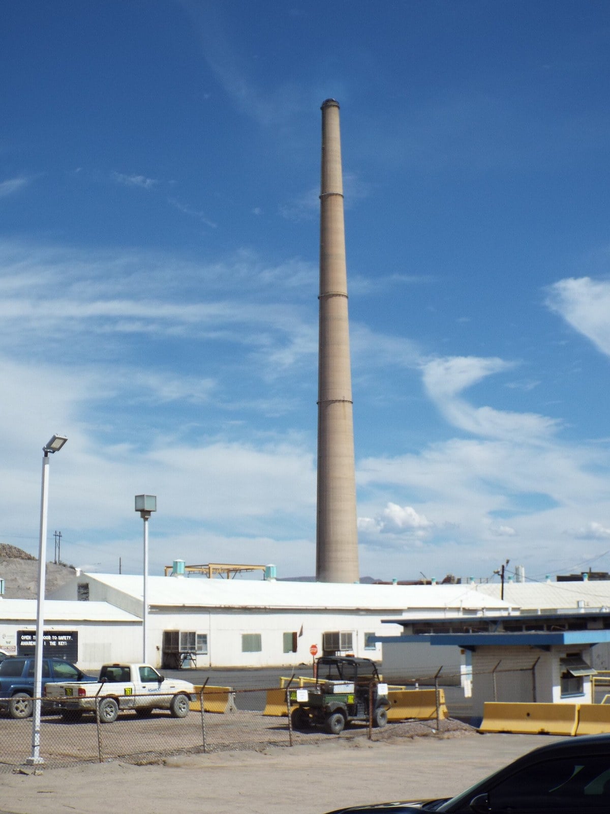 The tall chimney of the Hayden copper smelter in Hayden, Arizona