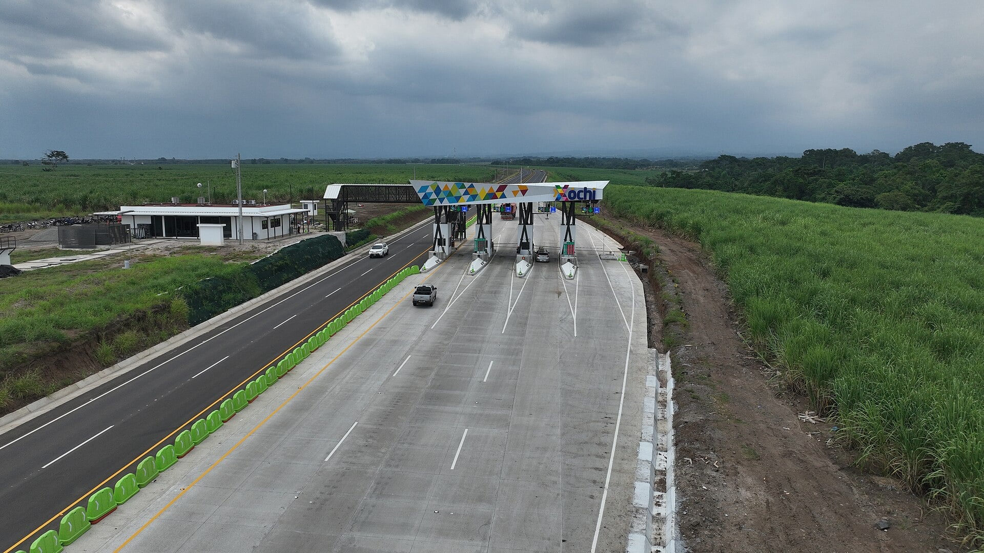 Aerial view of a toll plaza on the Xochi highway between sugarcane fields in Guatemala
