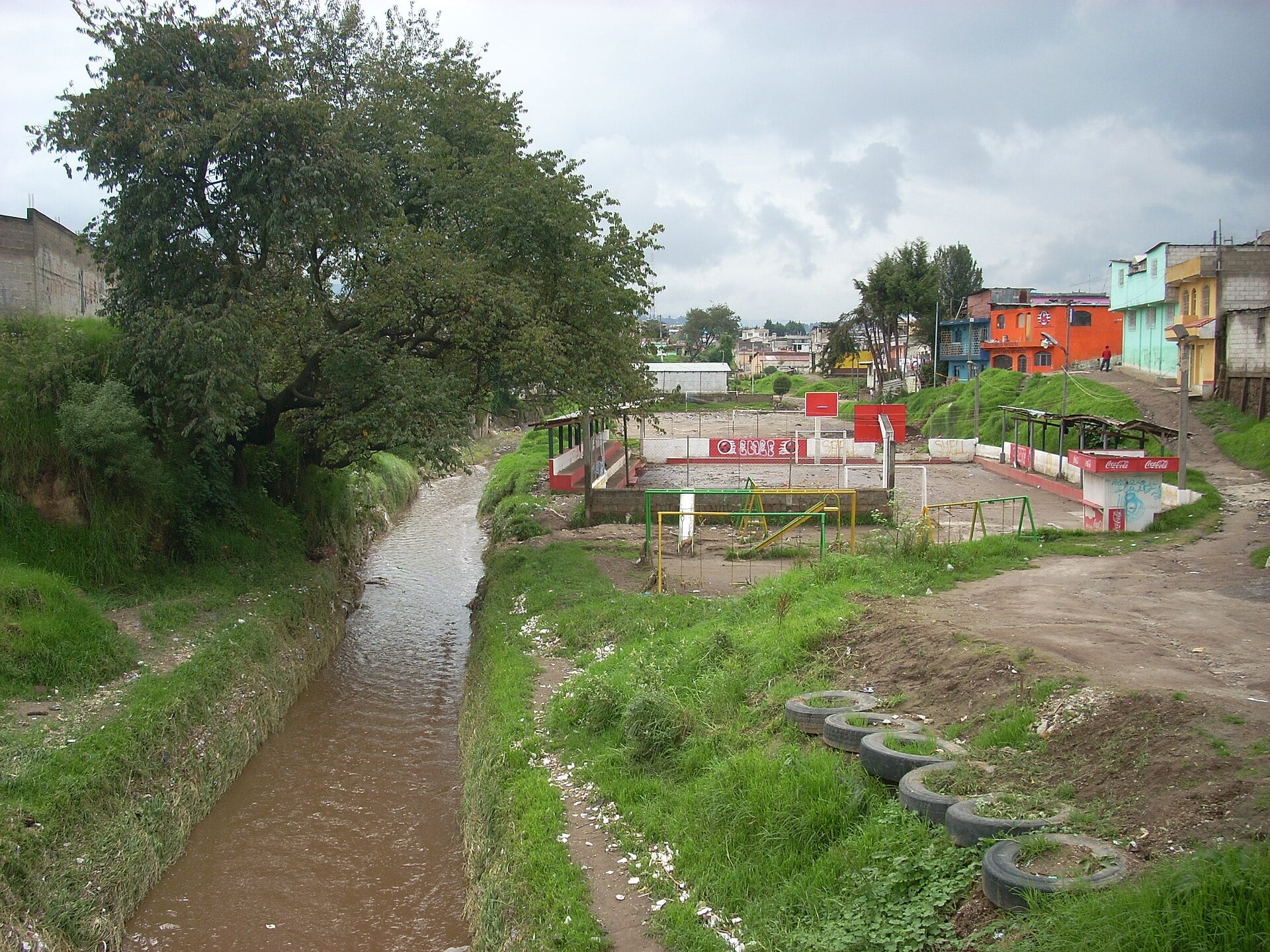 Muddy runoff in the Río Seco channel in Quetzaltenango, Guatemala, after a tropical depression