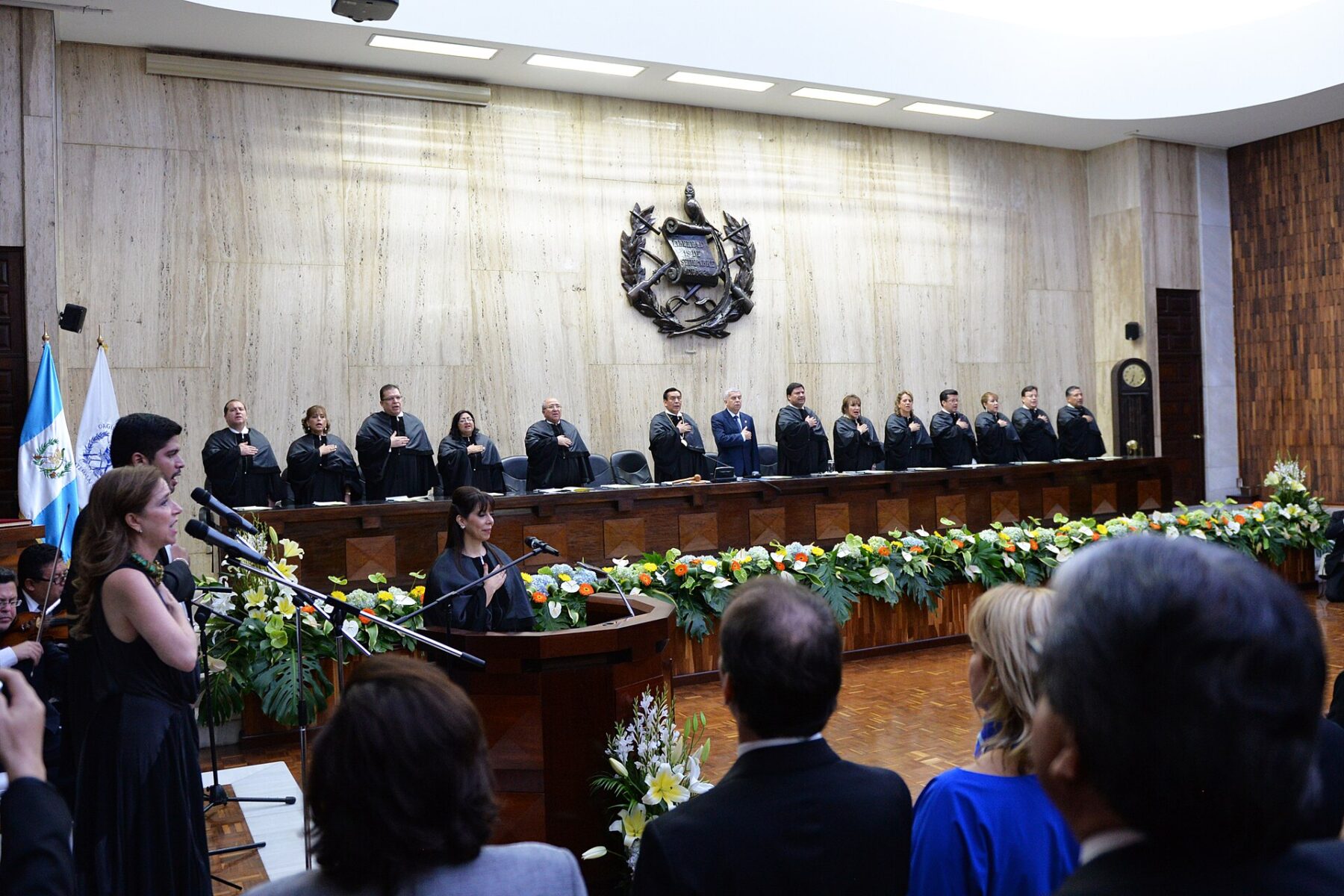 Robed magistrates stand at the bench during a ceremony at the Supreme Court of Justice in Guatemala City