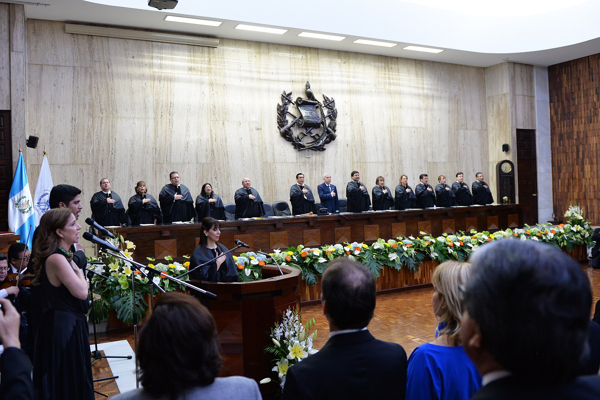 Robed magistrates stand at the bench during a ceremony at the Supreme Court of Justice in Guatemala City
