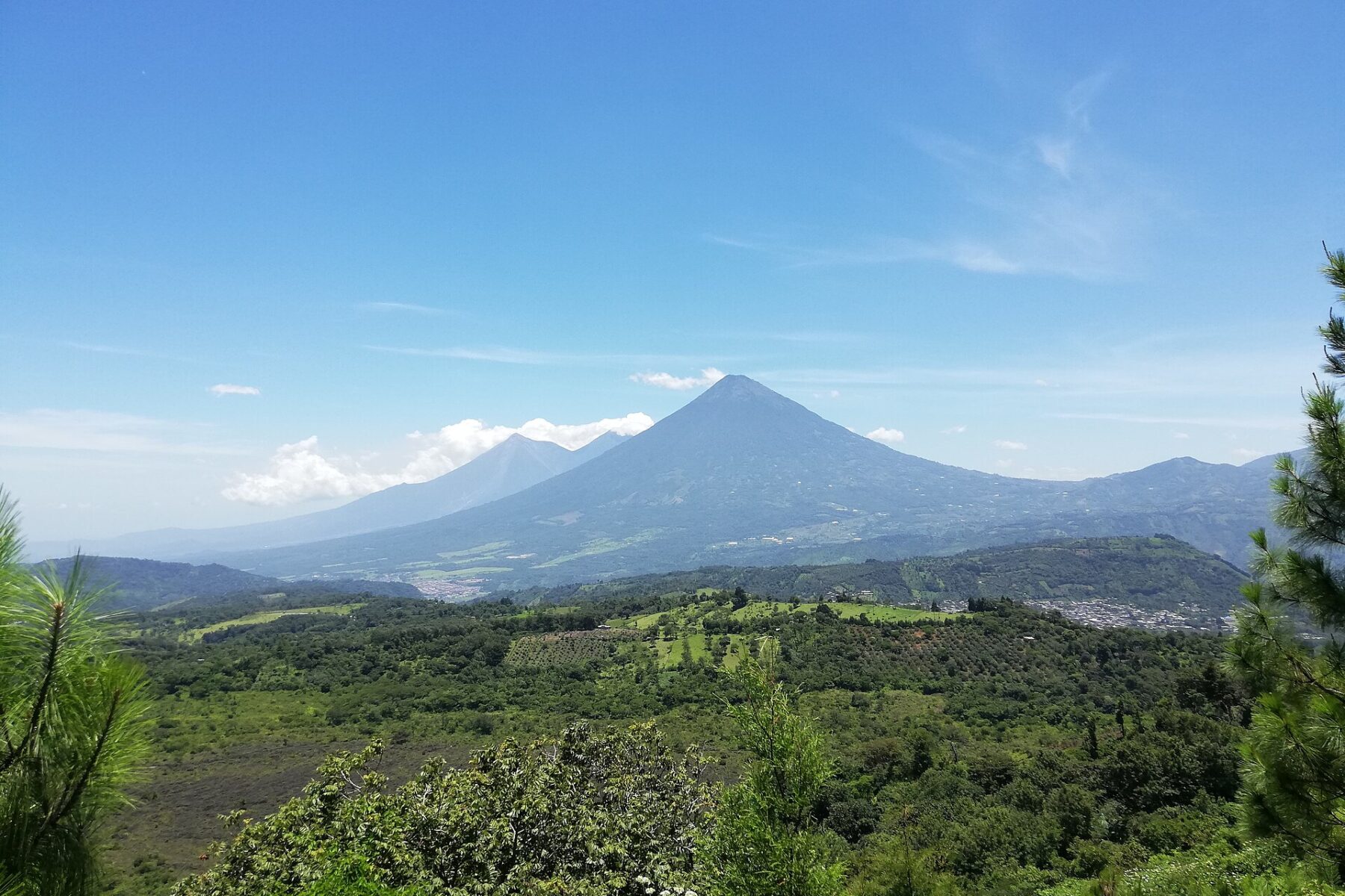 Volcán de Agua rising above forests and farmland near Antigua Guatemala, Guatemala