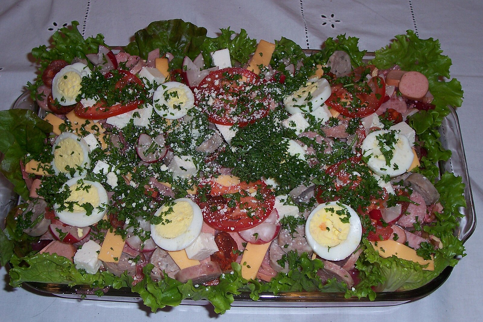 Guatemala food: a tray of fiambre with eggs, sausages, cheese and vegetables