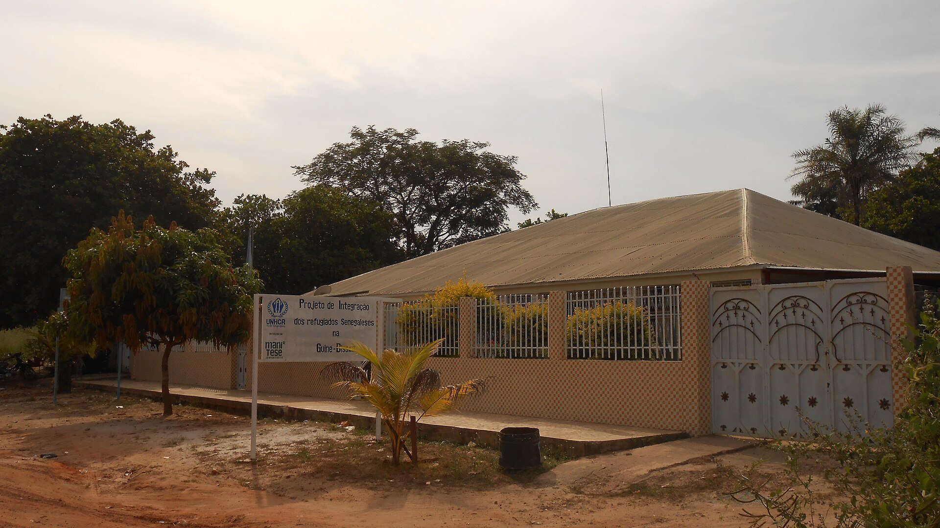 A building in Sao Domingos, northern Guinea-Bissau, with a sign for a project to integrate Senegalese refugees, near the Senegal border.