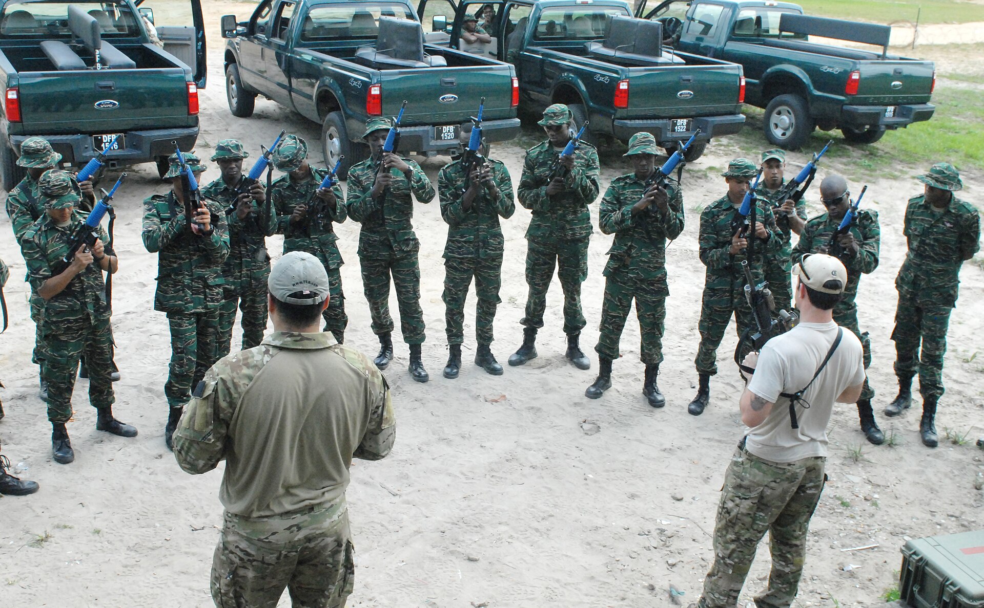 Guyana Defence Force soldiers handling training rifles during a weapons familiarization exercise outside Georgetown