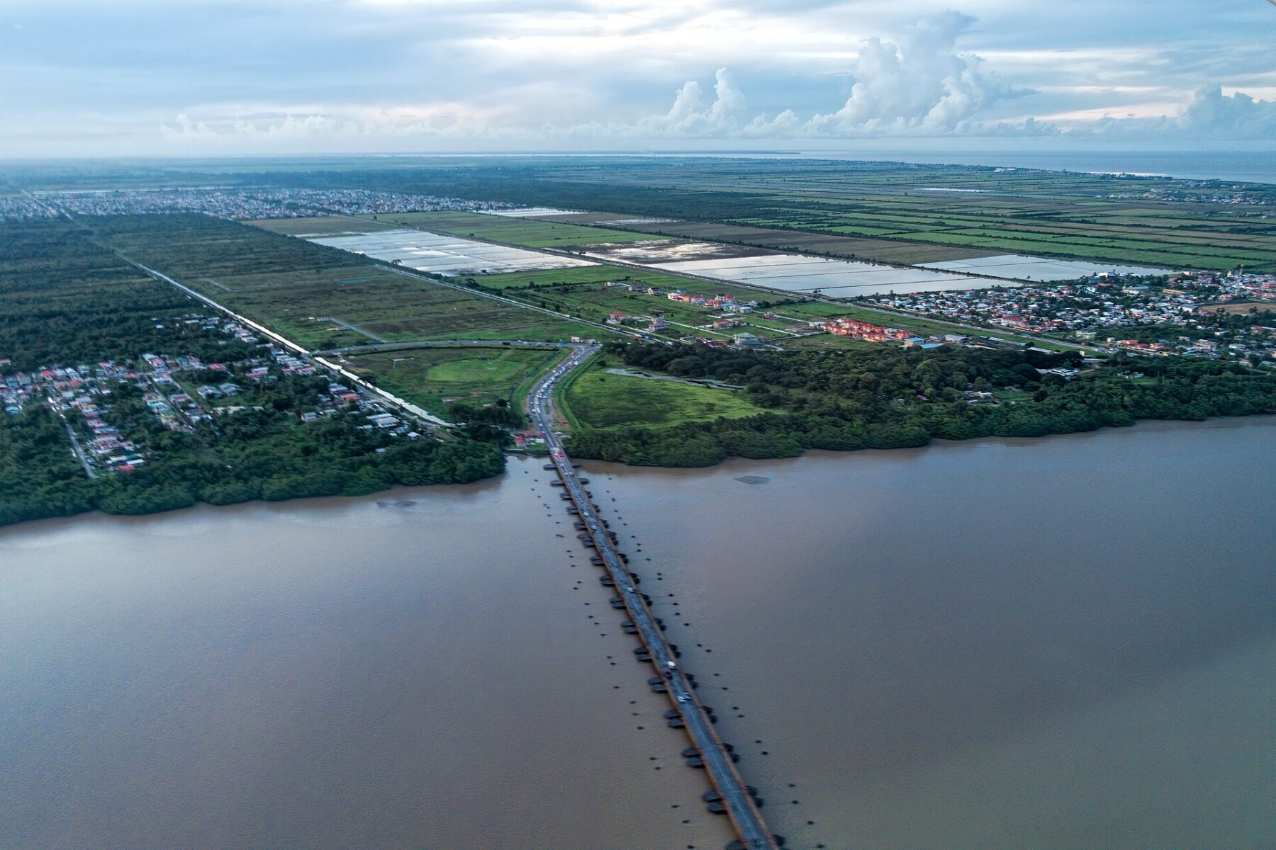 Aerial view of the Demerara Harbour Bridge crossing the brown Demerara River to the West Bank, Guyana