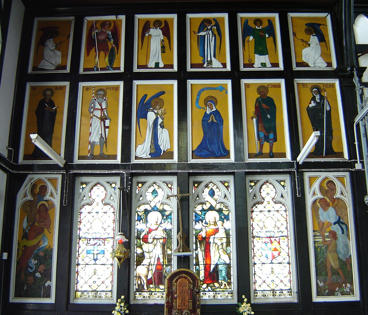 Painted saints' panels and stained-glass windows inside St George's Cathedral in Georgetown, Guyana