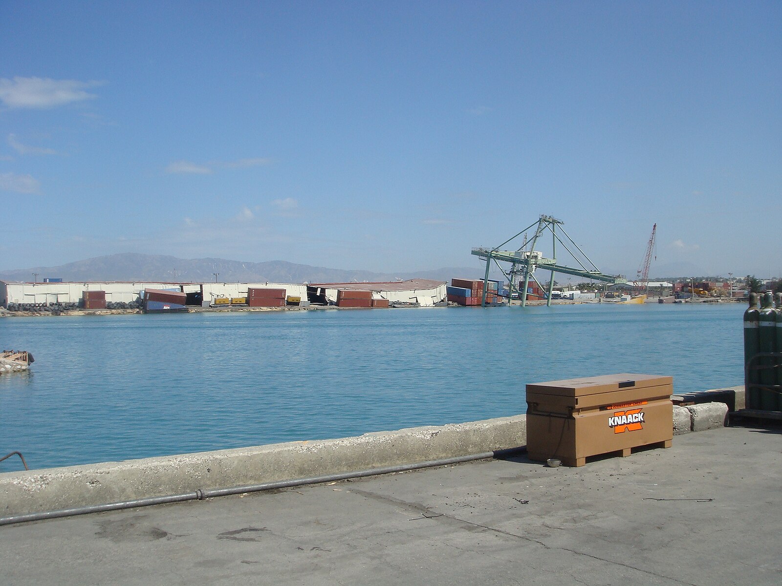 Haiti continent trade: containers and a damaged crane at the port of Port-au-Prince