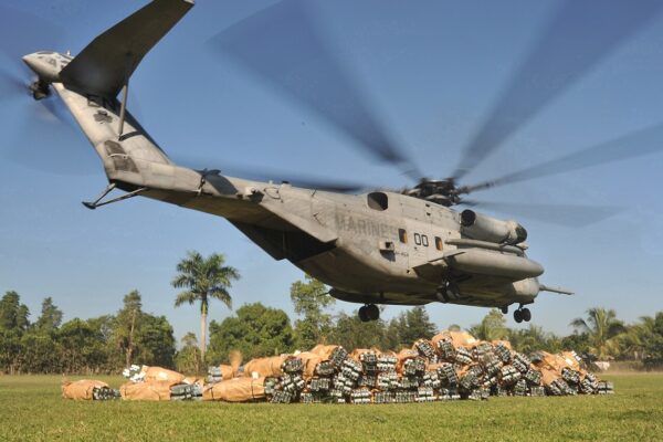 A US Marine Corps heavy-lift helicopter lifts off from a field in Cap-Haïtien, Haiti, after dropping off relief supplies