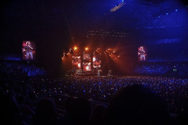 Stage, video screens and a large crowd during a concert inside the arena in Santiago, Chile, then named Movistar Arena