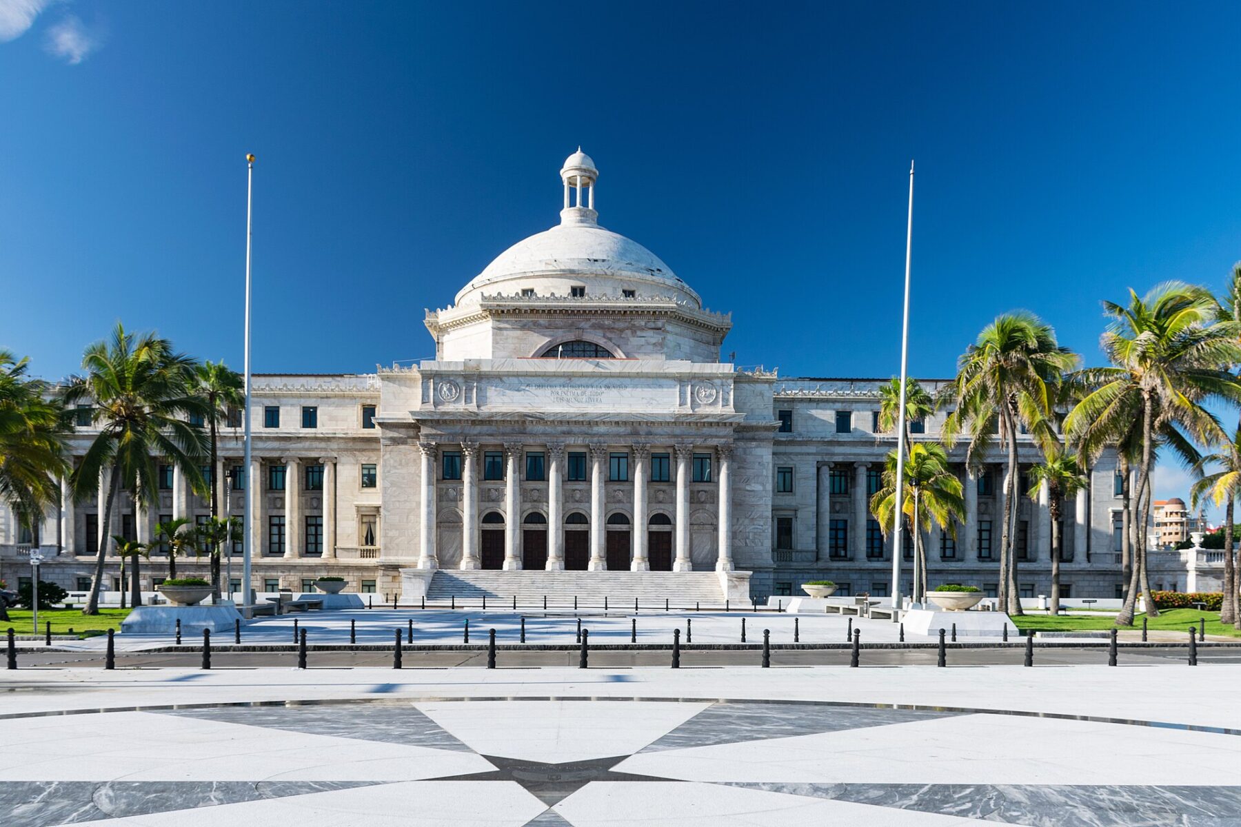 Front facade of the Capitol of Puerto Rico in San Juan under a blue sky