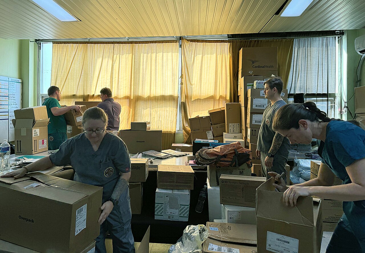 US Navy medical staff unpacking boxes of supplies in a room at Hospital Escuela in Tegucigalpa, Honduras