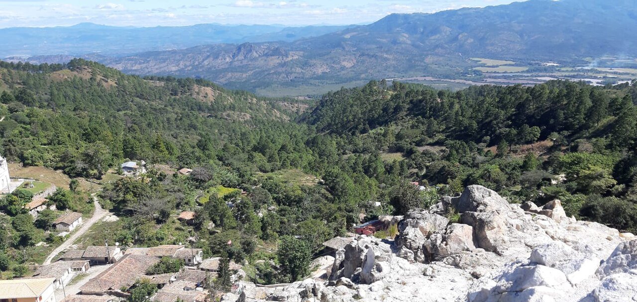 Panorama of San Antonio de Oriente in Honduras with tiled roofs, pine forest and mountains