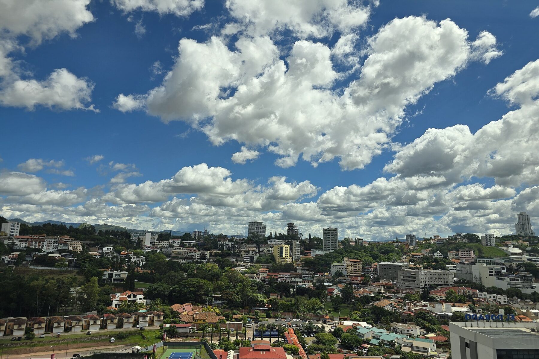 Cumulus clouds over hillside neighbourhoods of Tegucigalpa, the Honduran capital
