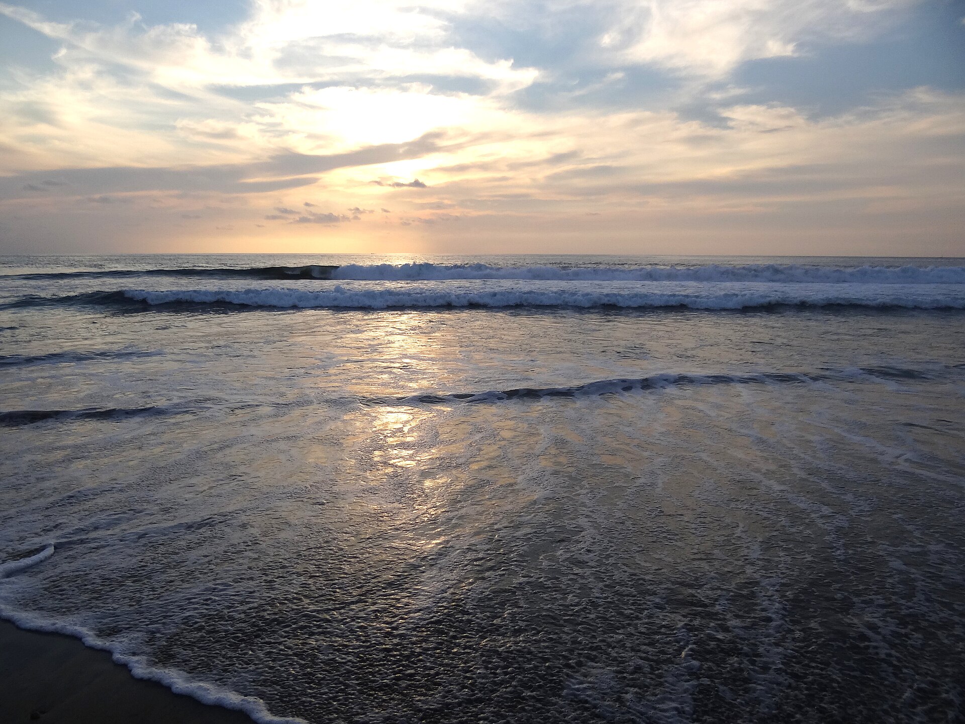Waves break on Zicatela Beach at sunset in Puerto Escondido, Oaxaca, Mexico
