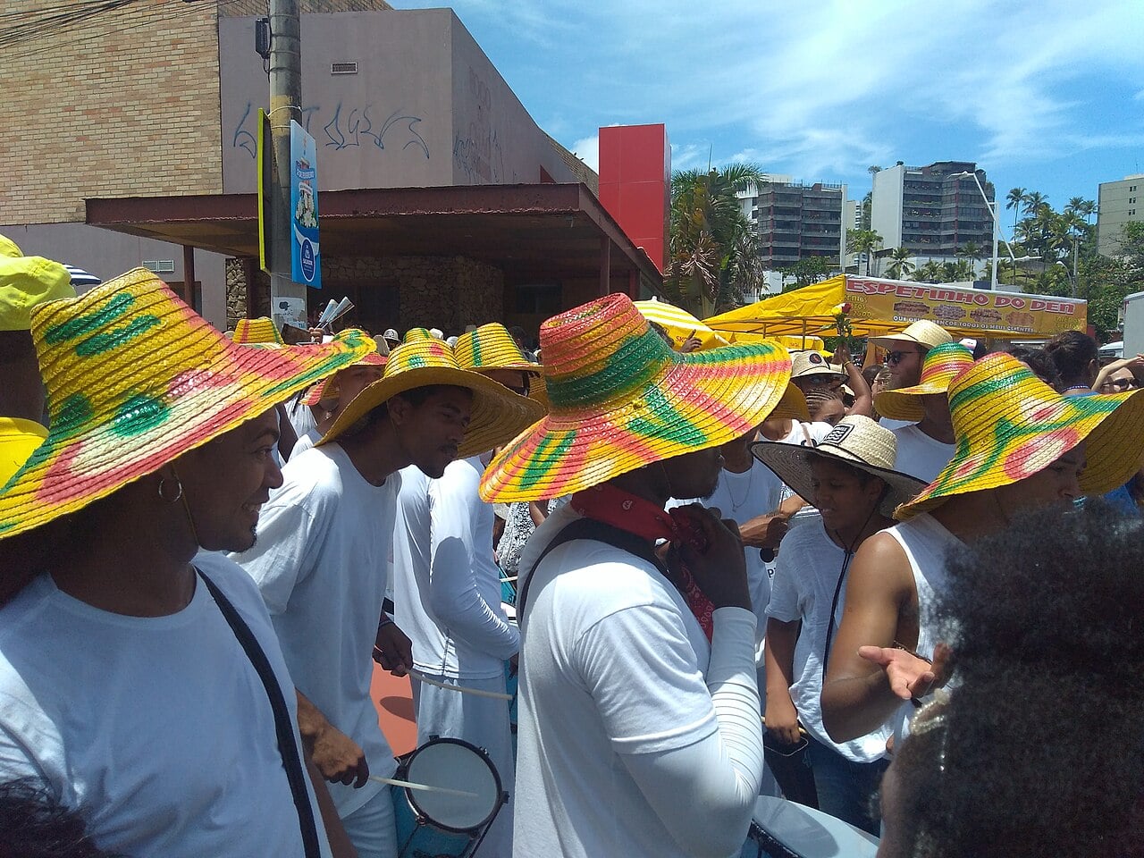 Drummers in white shirts and colourful straw hats play at the Iemanjá festival in Rio Vermelho, Salvador, Brazil, in 2019.