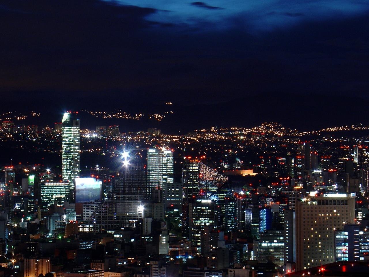 Mexico City skyline and the Reforma district lit up at night