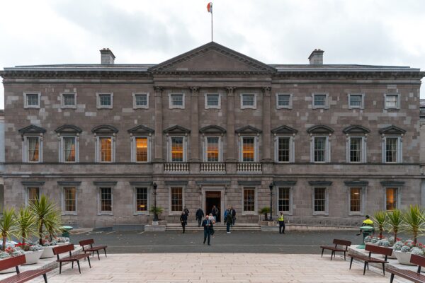 Leinster House in Dublin, the grey stone seat of Ireland's parliament, with the Irish flag above the entrance