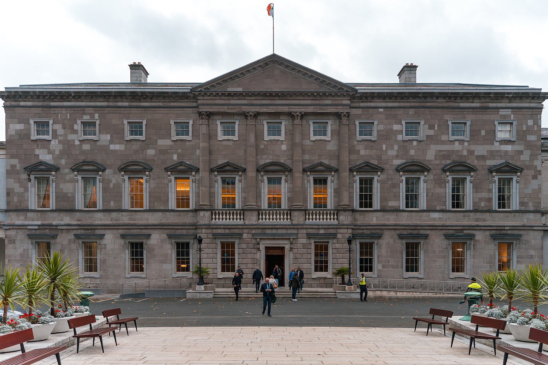 Leinster House in Dublin, the grey stone seat of Ireland's parliament, with the Irish flag above the entrance