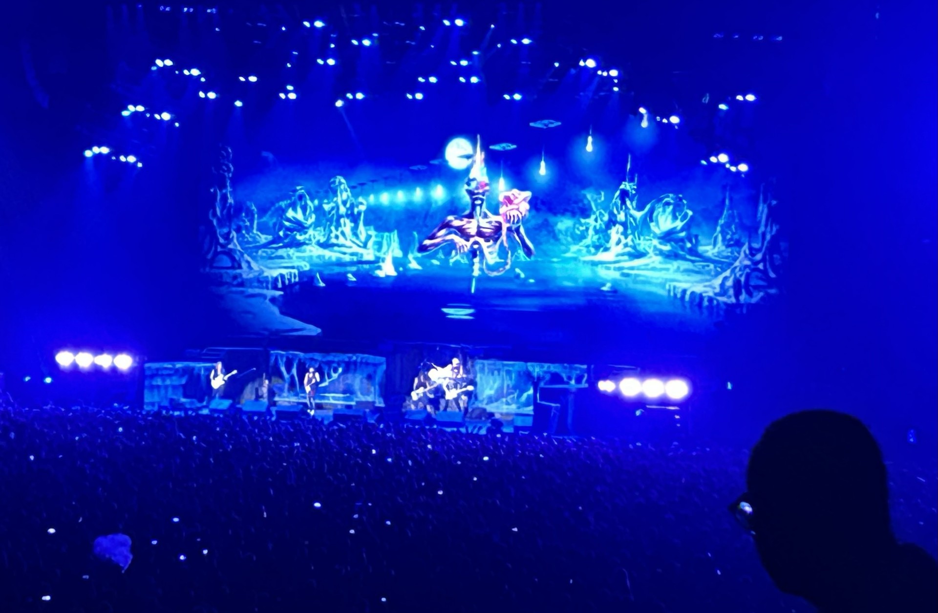 Iron Maiden performing on stage during a live concert