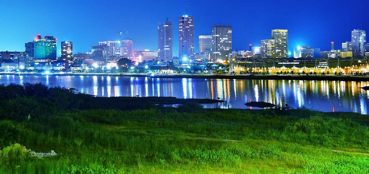 Night view of the Plateau business district skyline across the lagoon in Abidjan, Ivory Coast