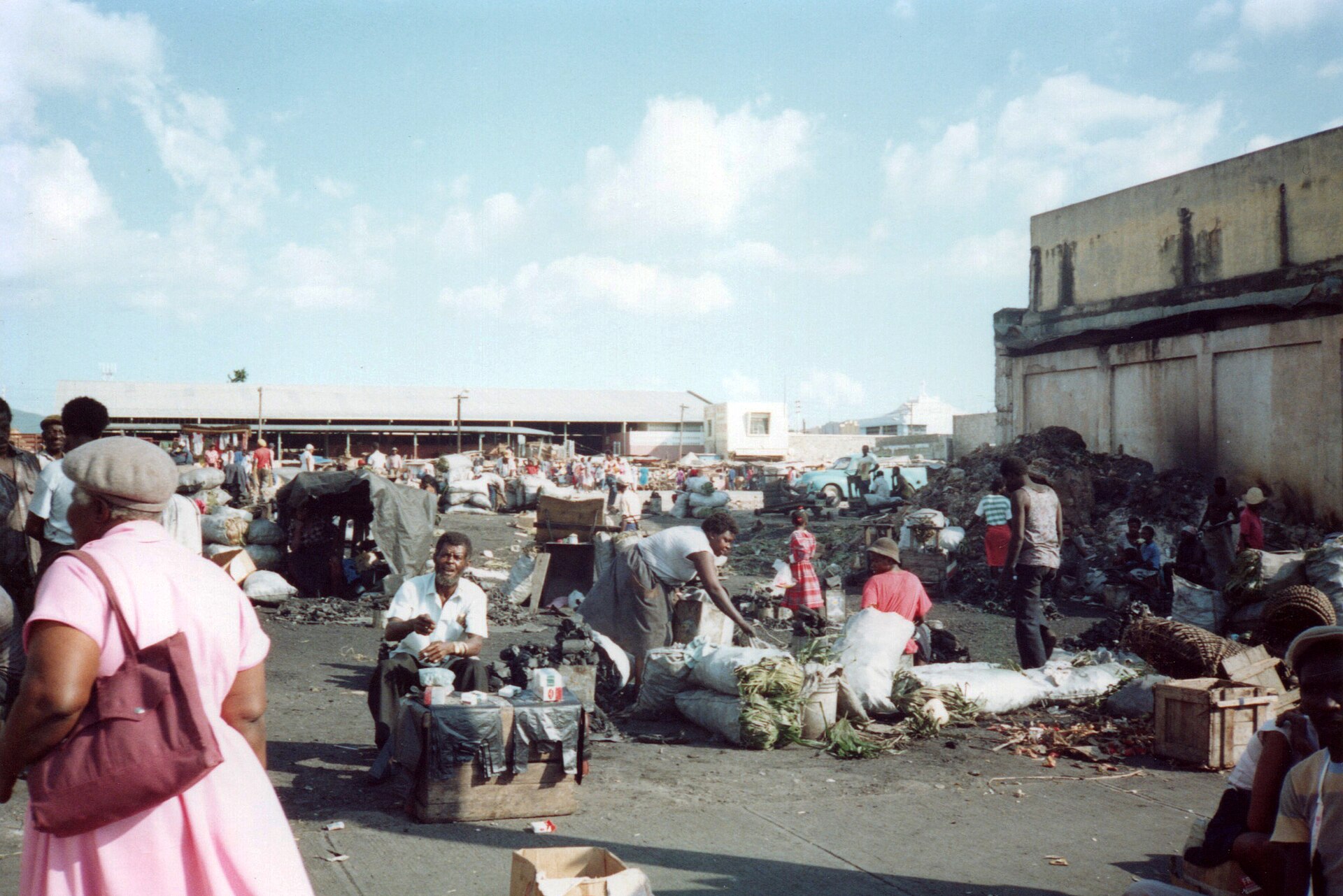 Vendors and shoppers at an open-air market area in downtown Kingston, Jamaica
