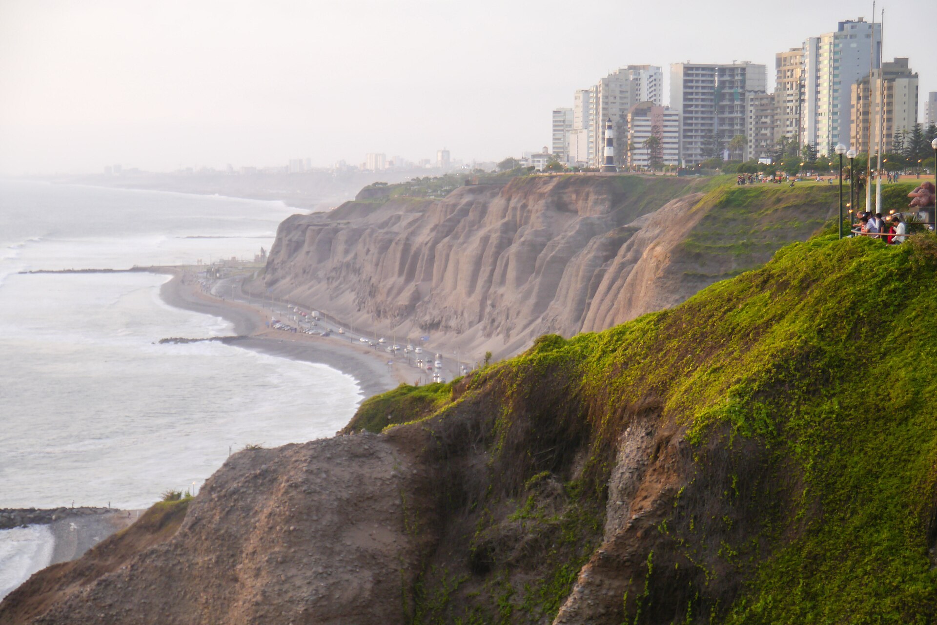 Cliffs of Miraflores above the Costa Verde road in Lima, with the La Marina lighthouse and apartment towers