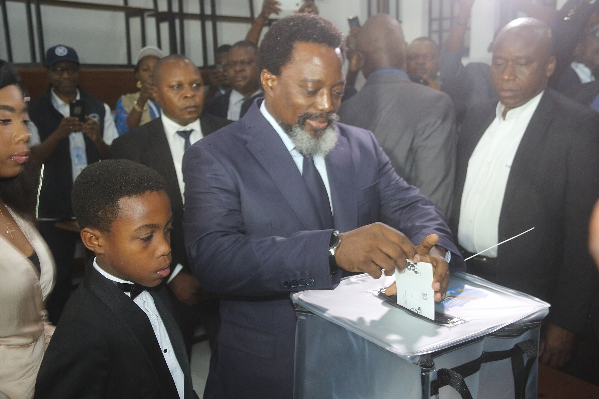Joseph Kabila dropping his ballot into a clear box at a polling station in Congo on 30 December 2018