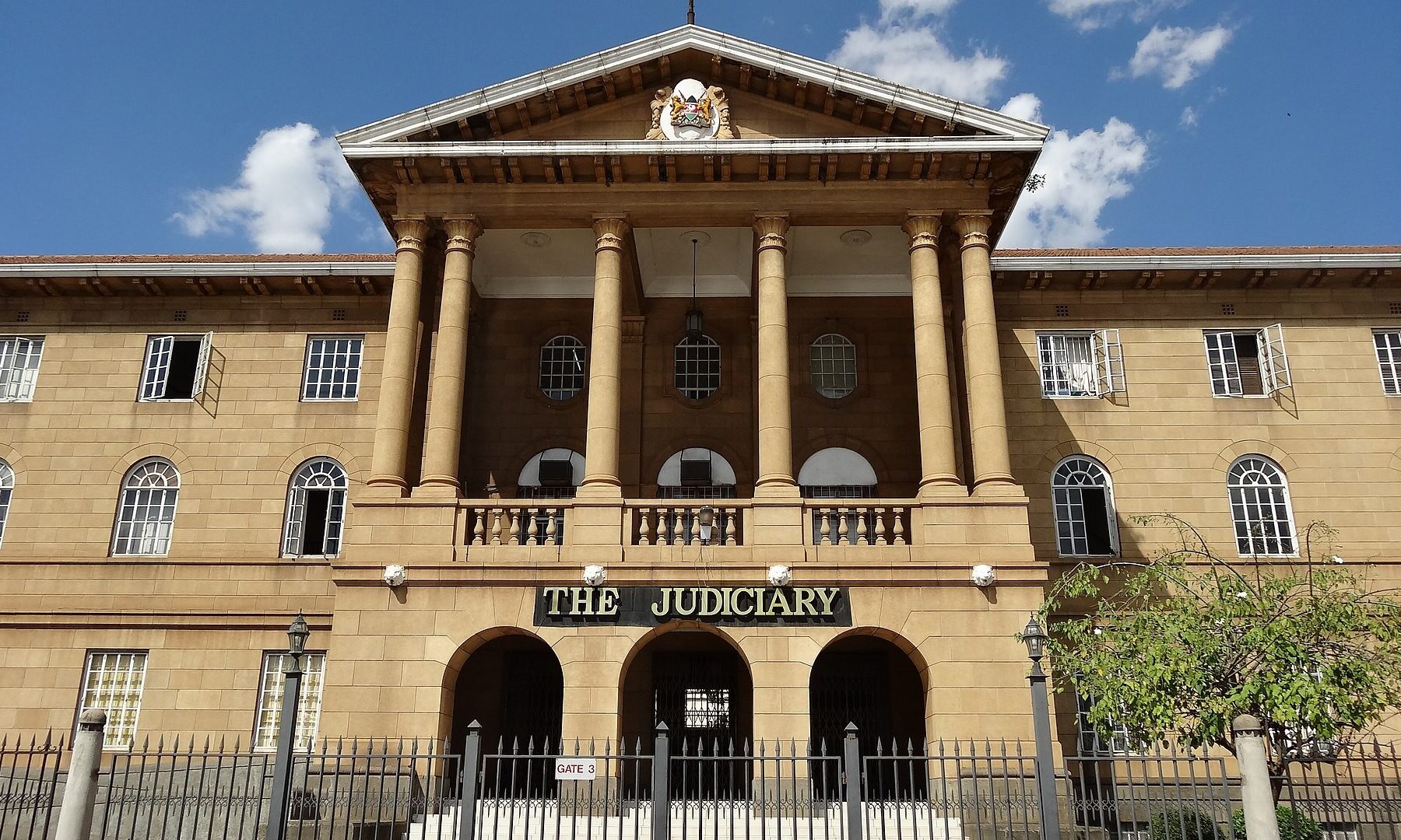 The Judiciary building in central Nairobi, with its columned entrance and the sign The Judiciary