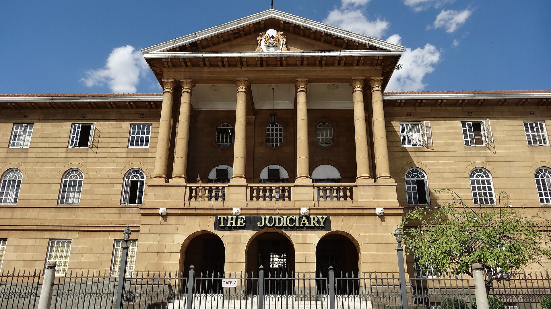 The Judiciary building in central Nairobi, with its columned entrance and the sign The Judiciary