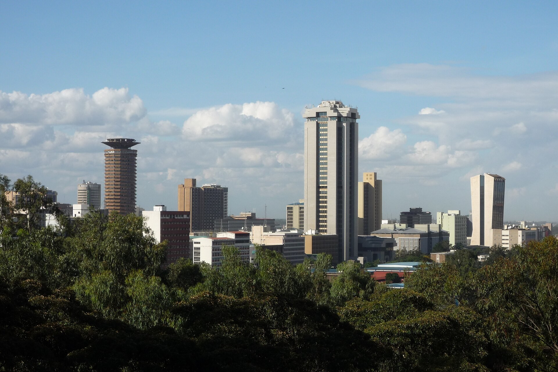 Skyline of central Nairobi, Kenya, seen over trees from Upper Hill, with the KICC tower on the left