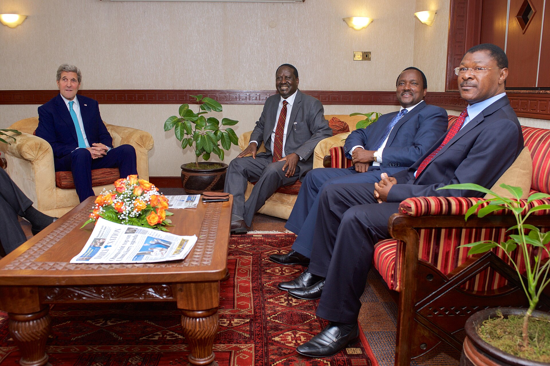 US Secretary of State John Kerry sits in a Nairobi room with Kenyan opposition leader Raila Odinga and two other Kenyan opposition politicians
